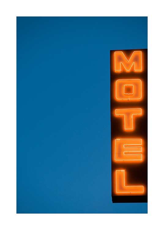  - Photographie d’une enseigne au néon avec le texte Motel sur un fond bleu foncé