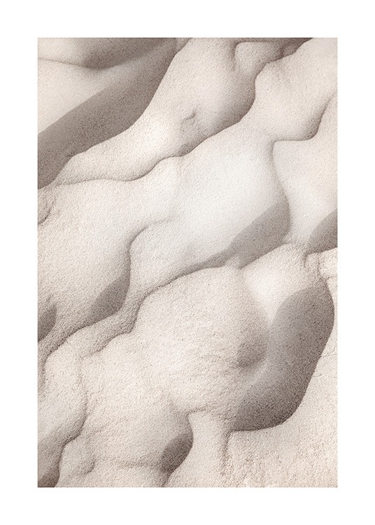  – Photographie de sable beige formant des formes abstraites