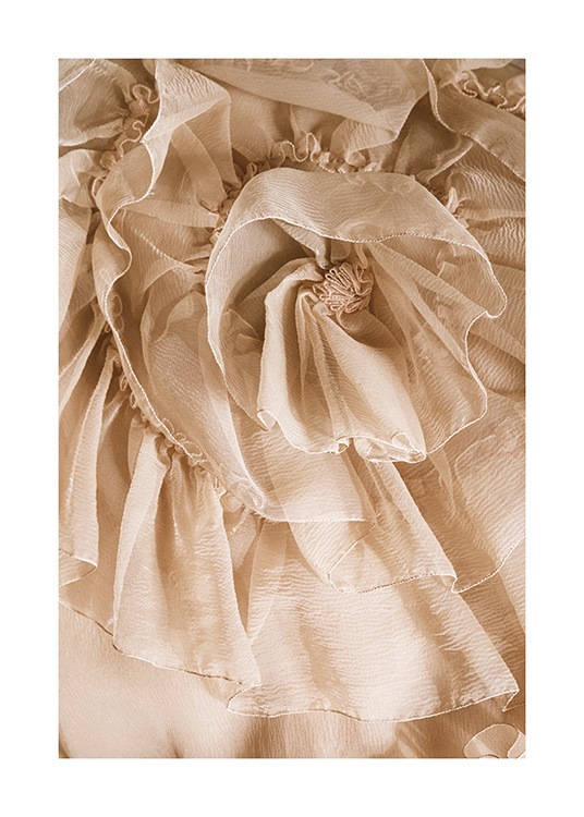  – Photographie d’un tissu en tulle froncé en beige, ressemblant à une fleur