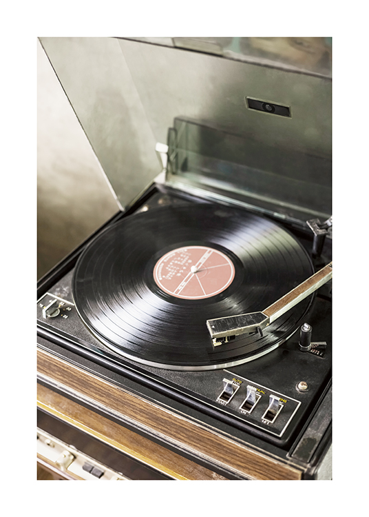  – Photographie d’un vieux tourne-disque avec un disque vinyle