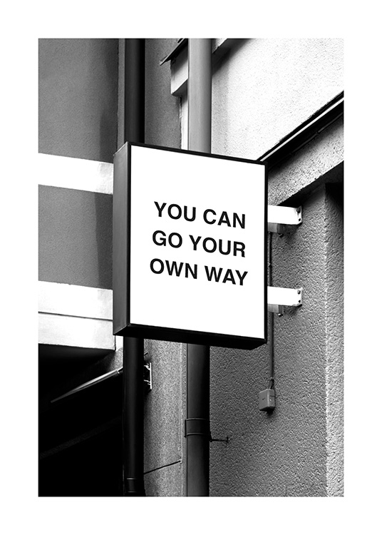 – Affiche de citation en noir et blanc avec un texte inspirant sur le mur d’une habitation