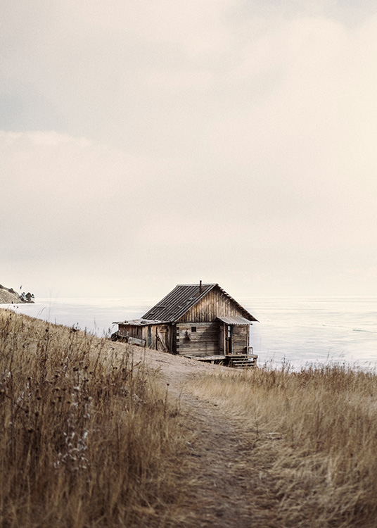 – Photographie d'un paysage avec une cabane marron au bord de la mer